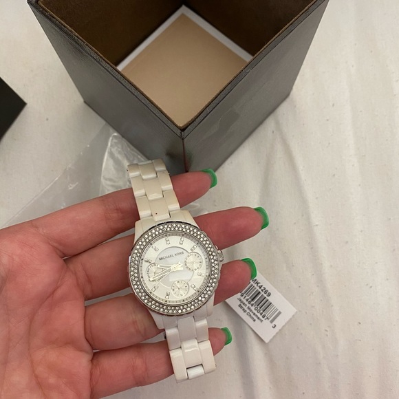 Michael Kors watch . There are some stain on links